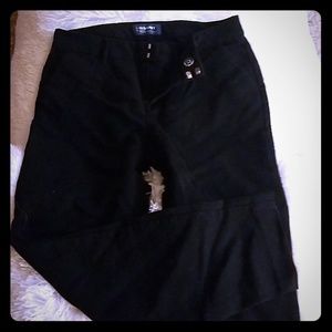 Mid-rise black pants.